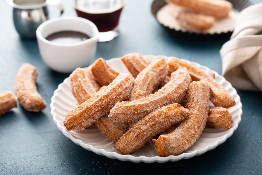 Homemade churros with cinnamon sugar on a plate