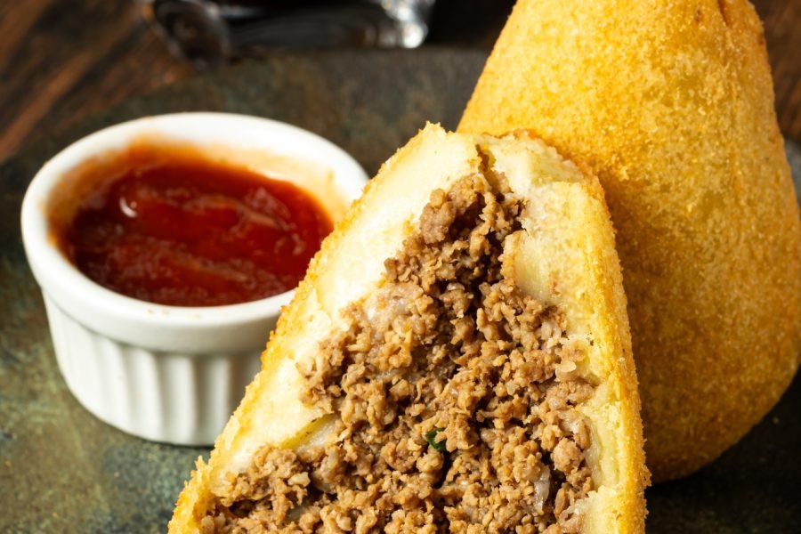 two traditional Brazilian coxinhas. typical fried snack food stuffed with meat and chicken