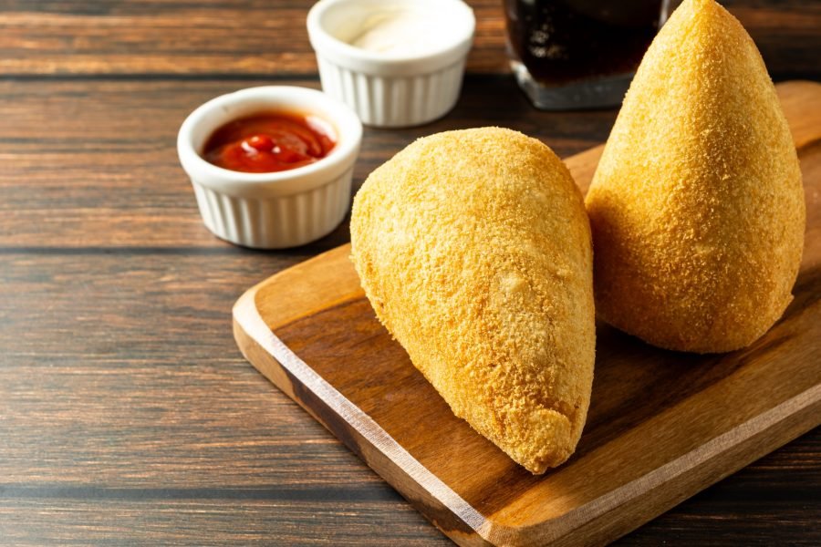 two traditional Brazilian coxinhas. typical fried snack food stuffed with meat and chicken